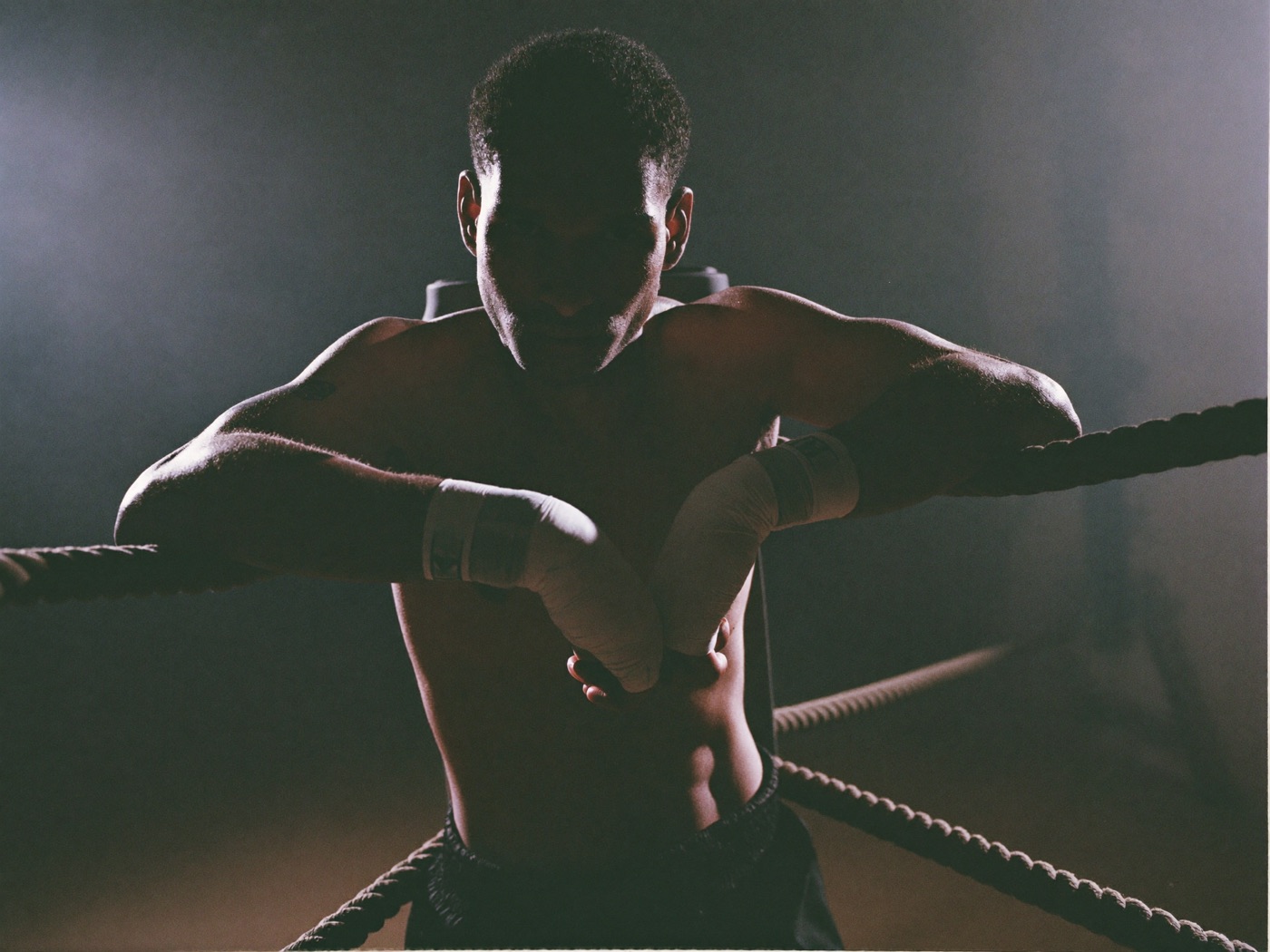 Boxer resting against the ropes